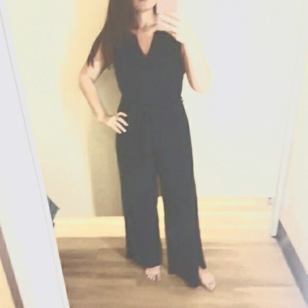 Women's navy blue sleeveless, belted  jumpsuit with side slit legs. Size large